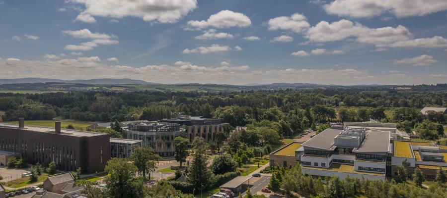 Aerial view of the Easter Bush Campus, with the Veterinary Teaching Building on the right, and the Roslin Institute on the left.