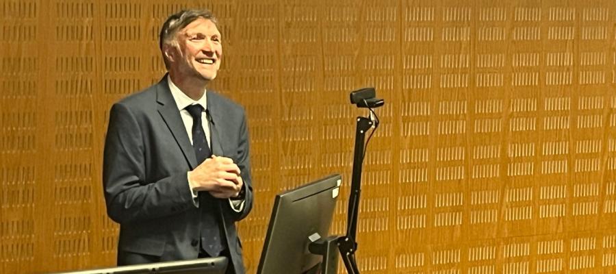 Professor Tom McNeilly smiles as he delivers his guest lecture.