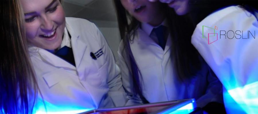 Student in PCR workshop with Roslin logo in the corner