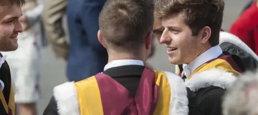 Two male students at graduation