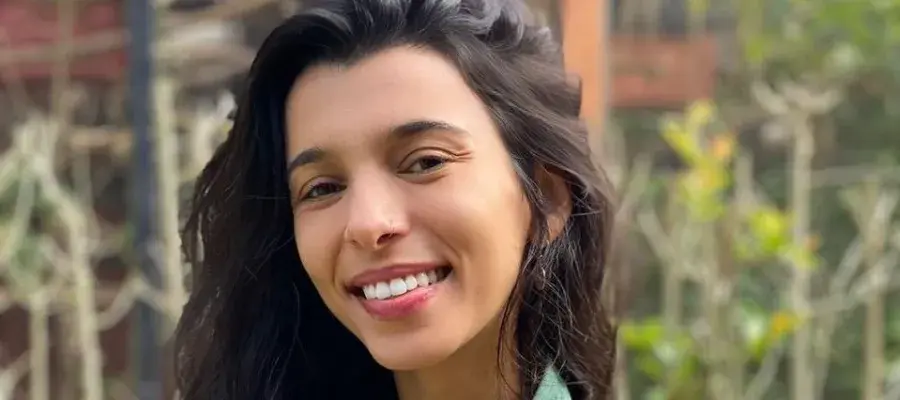 Isabela smiling at the camera