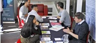 Staff and prospective students at an admissions event