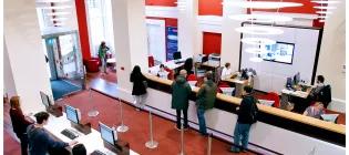 Students at the Academic Registry in Old College