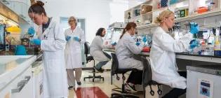 A team of scientists working in a lab at Roslin