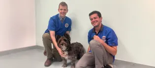 Dr Kevin McPeake and Dr Benjamin Cross with cairn terrier Mak