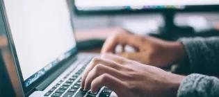 Generic image of someone typing on laptop