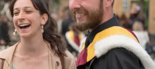 Graduating male student smiling