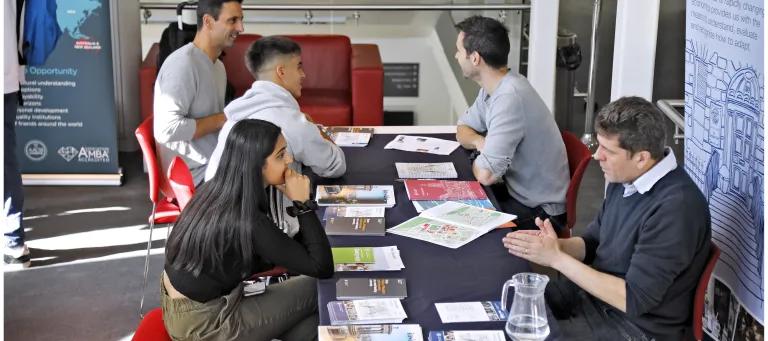 Staff and prospective students at an admissions event