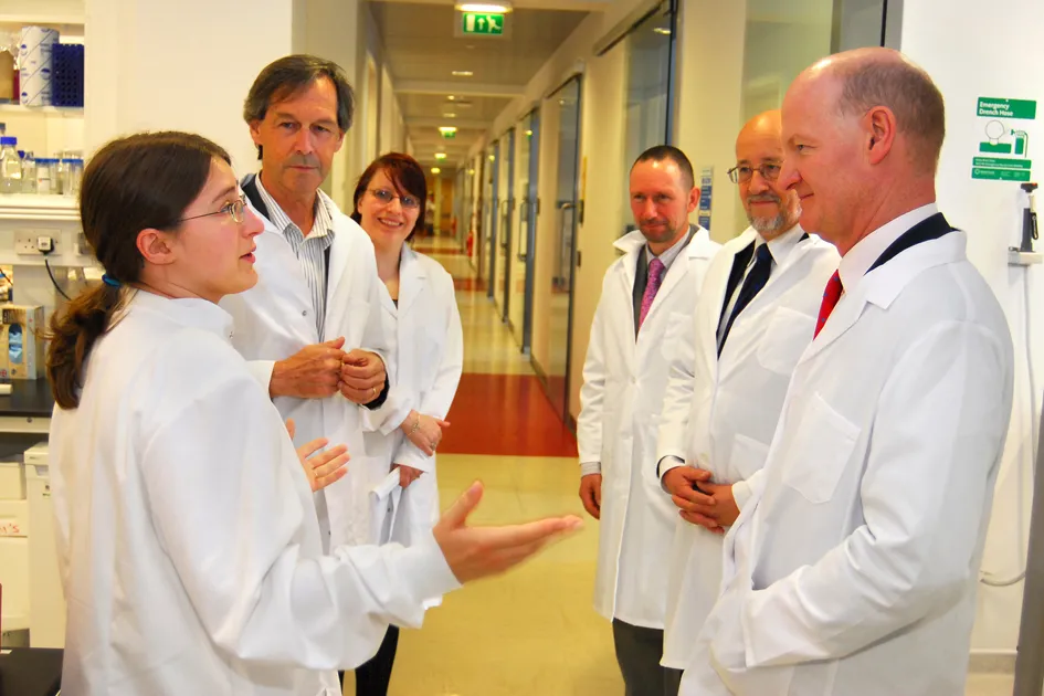 Staff with David Willetts in lab coats