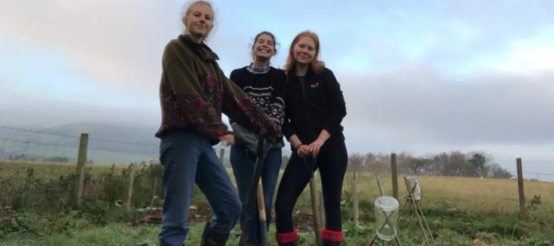 Students tend the campus plot.