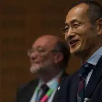 Prof Shinya Yamanaka, Prof Bruce Whitelaw in the background