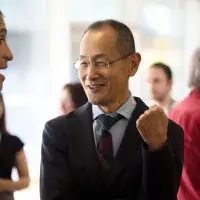Prof Shinya Yamanaka talking to a member of the audience during the drinks reception