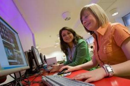 a student and supervisor looking at data on a screen