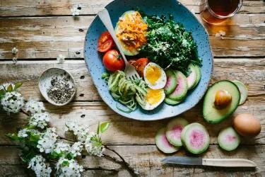 Plate of vegetables, pasta and hard-boiled eggs.