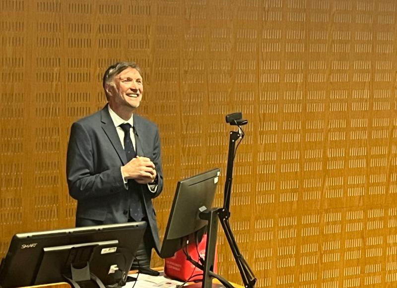 Professor Tom McNeilly smiles as he delivers his guest lecture.