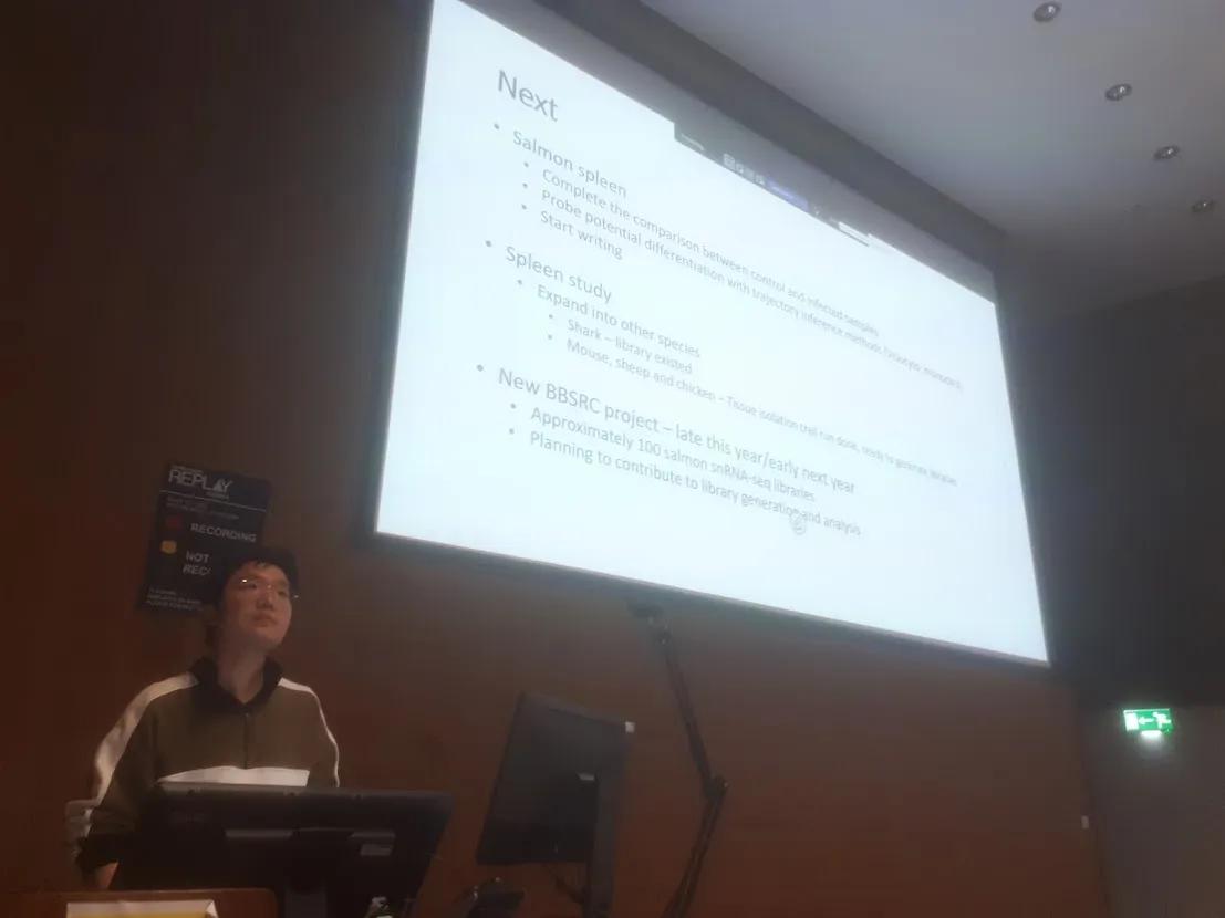 Jianxuan Sun explains the intricacies of single-cell sequencing to the rest of the team.