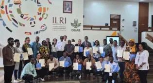 Workshop trainees posing with participation certificates