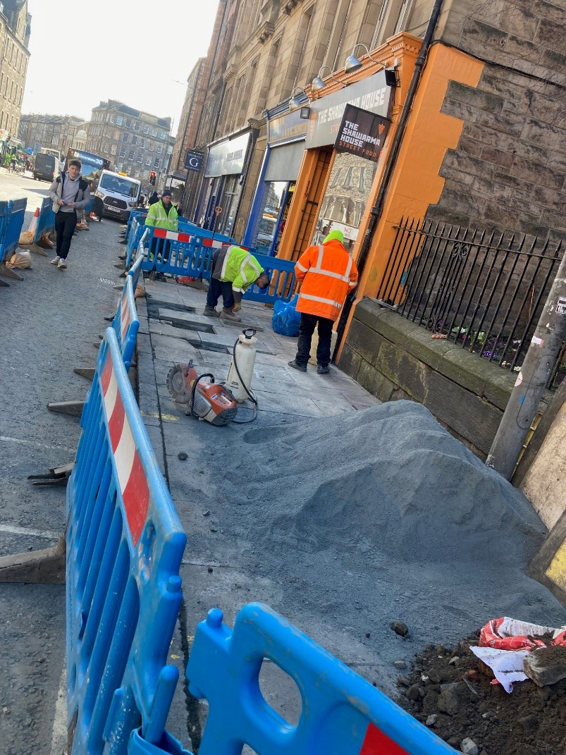 Internet cabling being installed under the pavement in front of the All4Paws building.