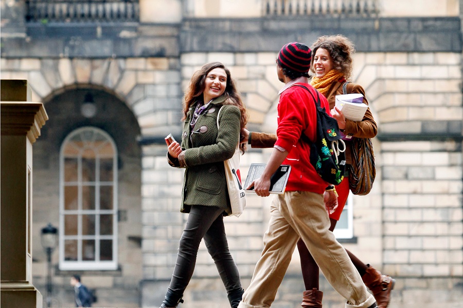 students chatting whilst walking past Teviot