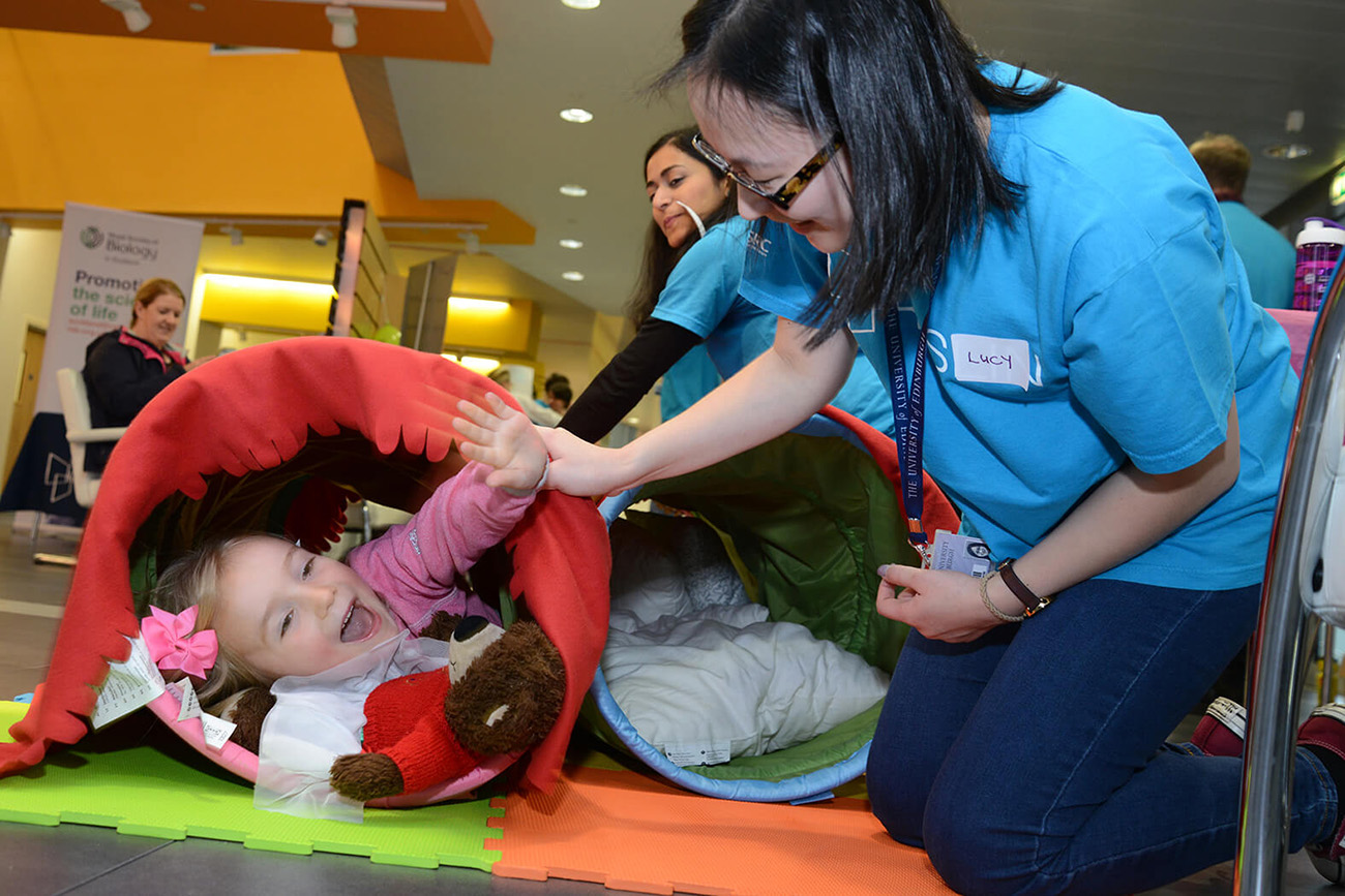 Young visitor learning about calcification in the aortic valve as part of our \"Heart of the Matter\" activity.