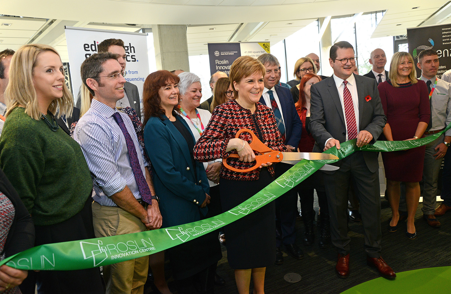 Nicola Sturgeon cutting the ribbon to inaugurate Roslin Innovation Centre with Chief Executive Officer John MacKenzie.