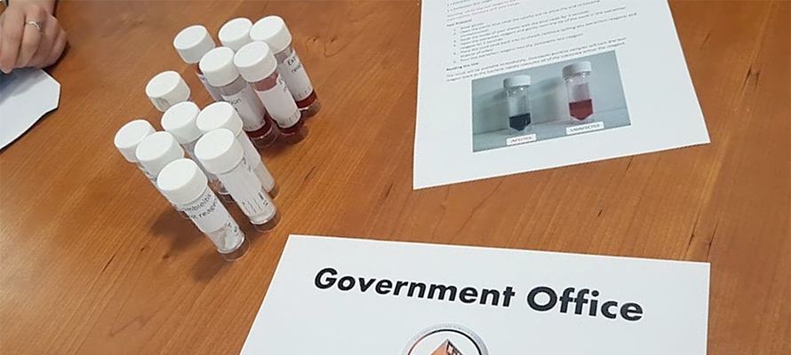 Test tubes and papers on a table