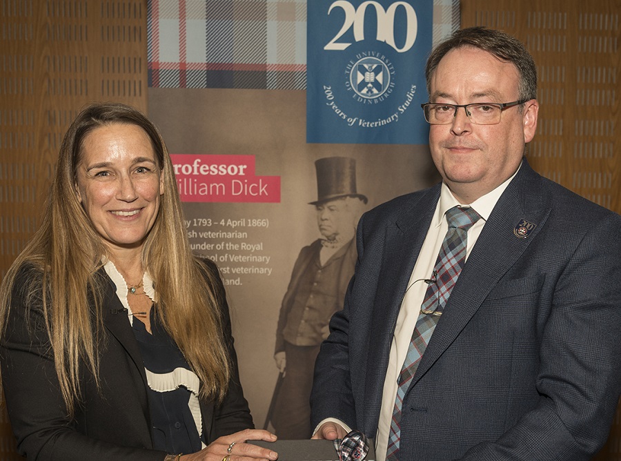 Professor Lisa Boden presenting Professor David Argyle with a gift