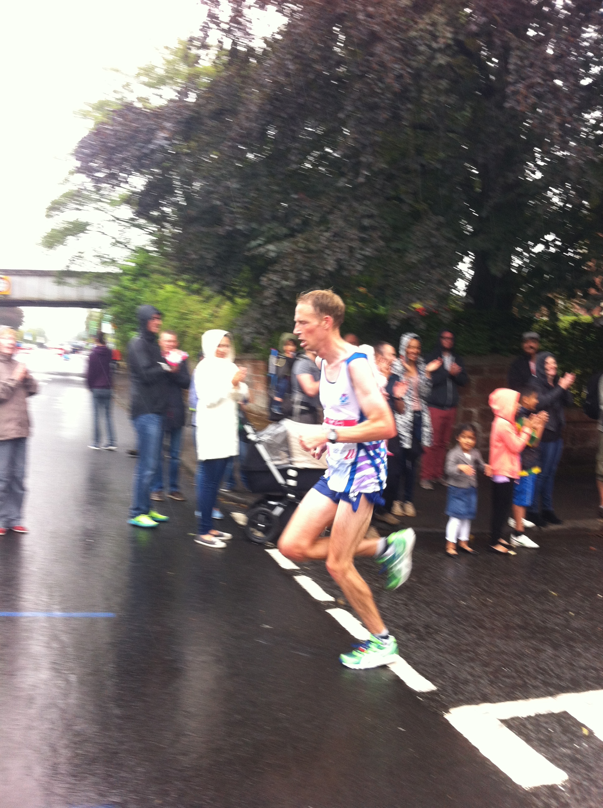 Ross crosses the line in a Scottish running competition.