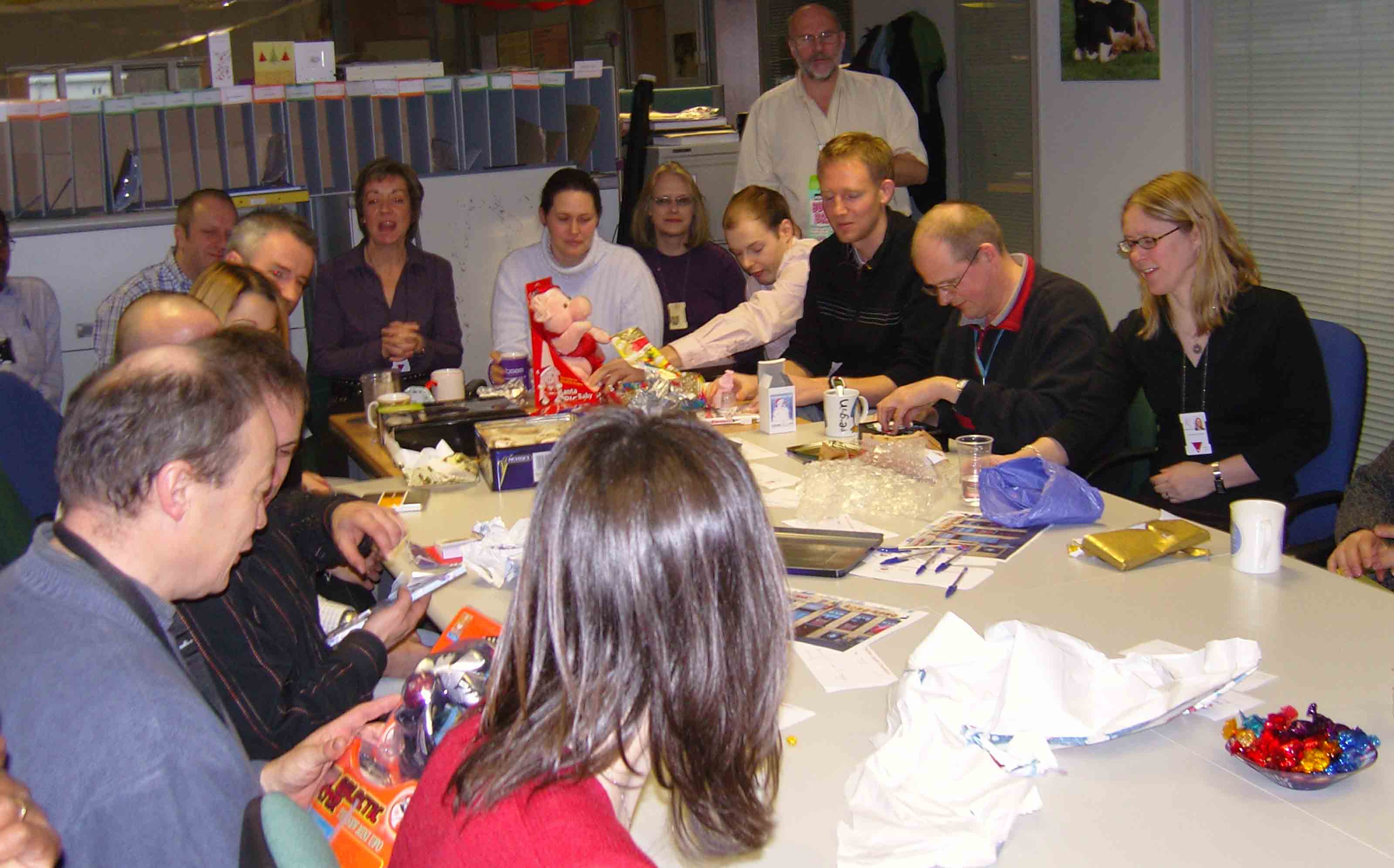 Ross partakes in a game of Secret Santa alongside colleagues. 