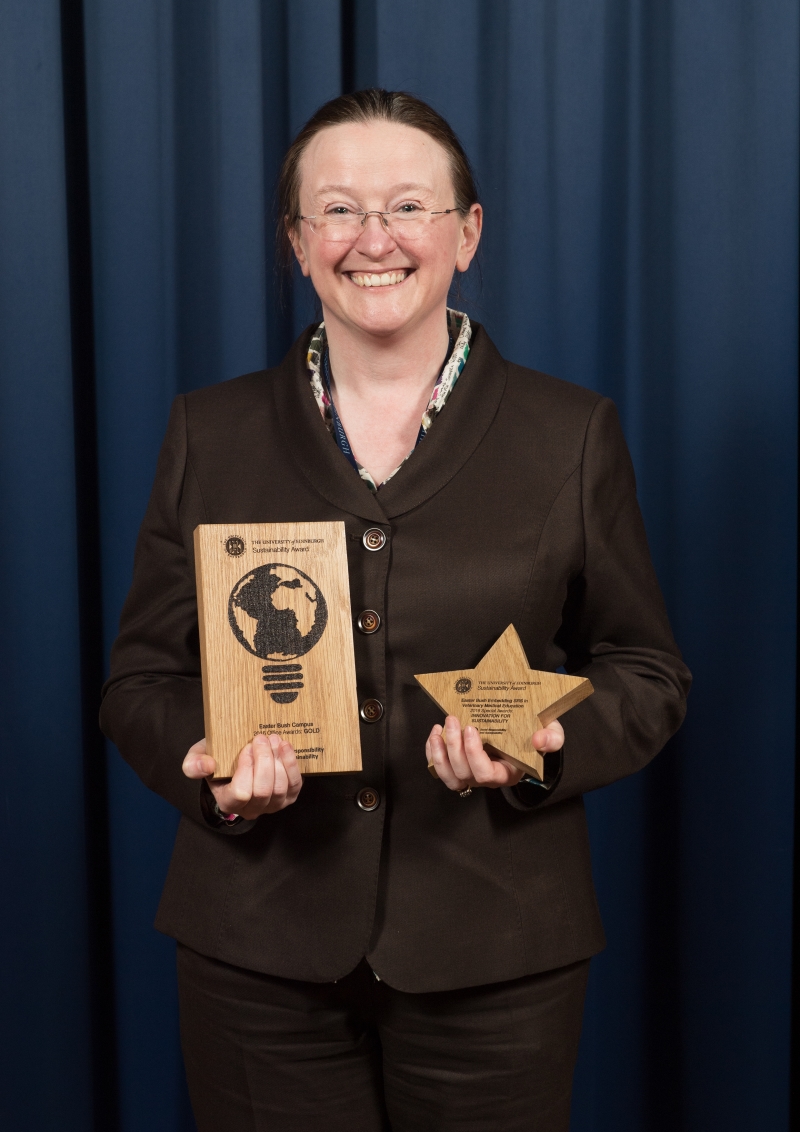 Sharon Boyd holding the awards.